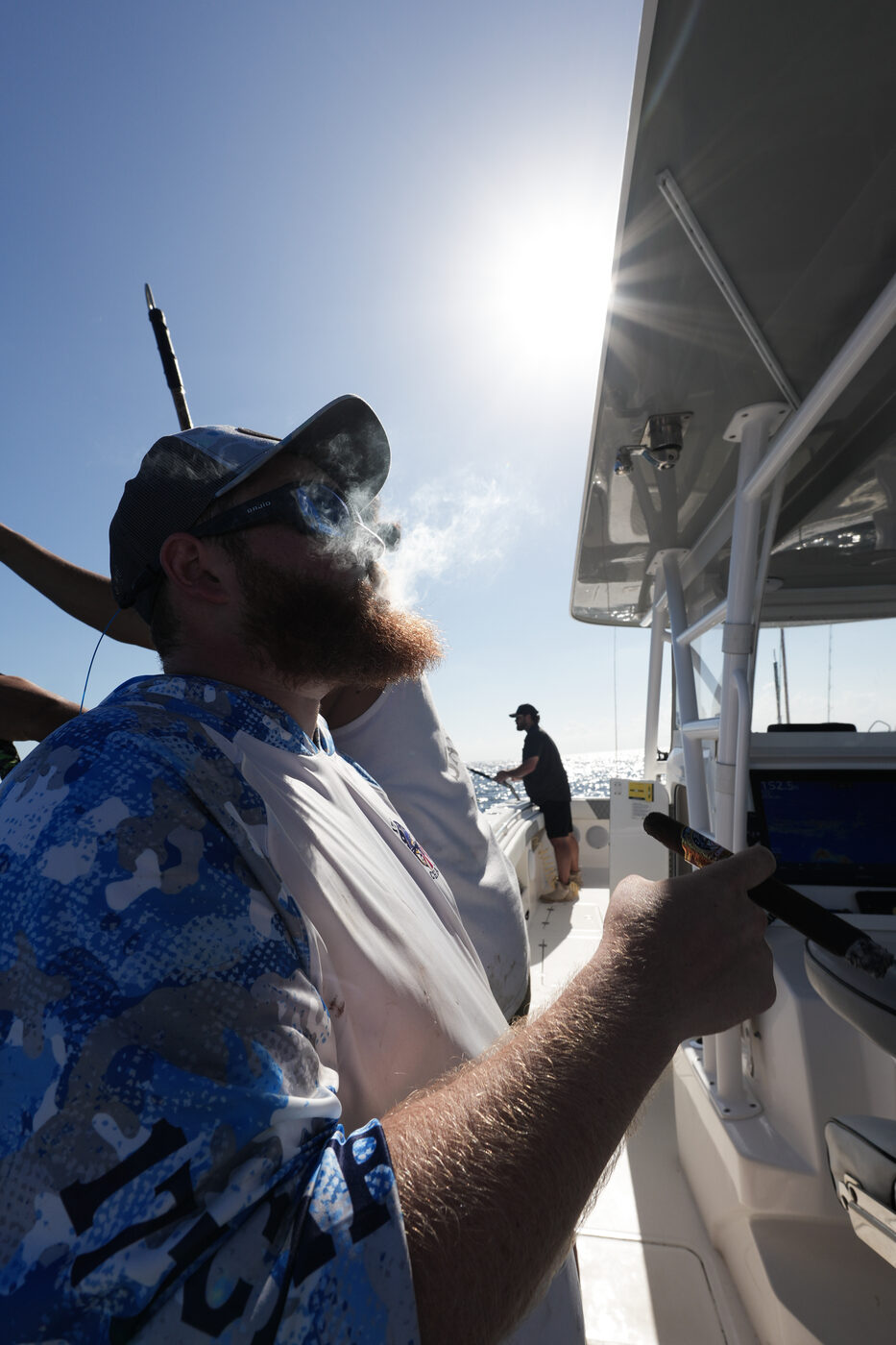 1776 Charters crew member with a cigar looking out over the Gulf