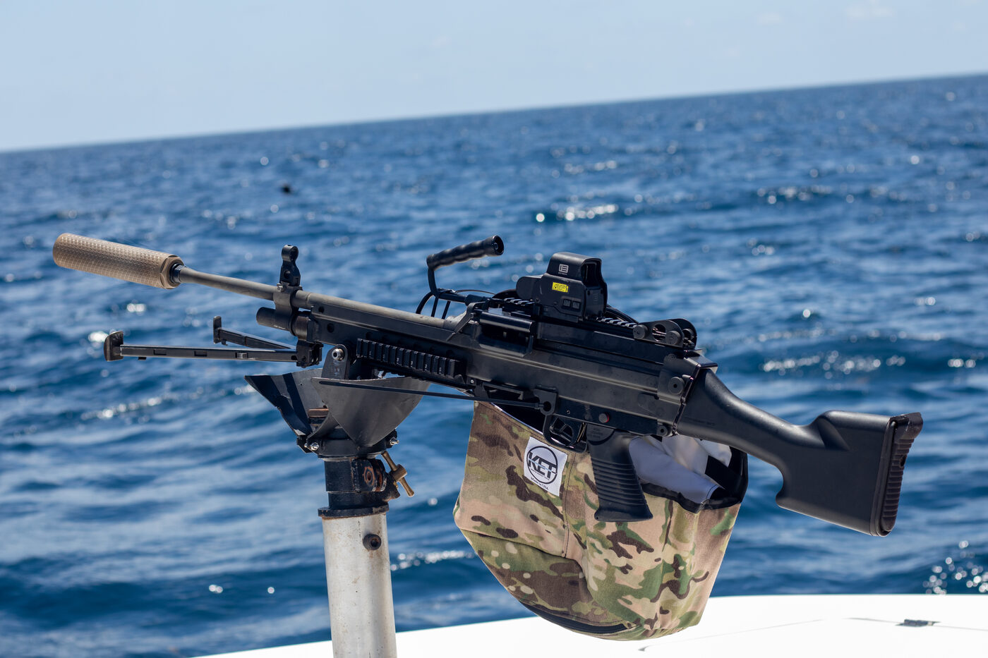 Detail of the deck-mounted belt-fed machine gun aboard 1776 Charters on blue water
