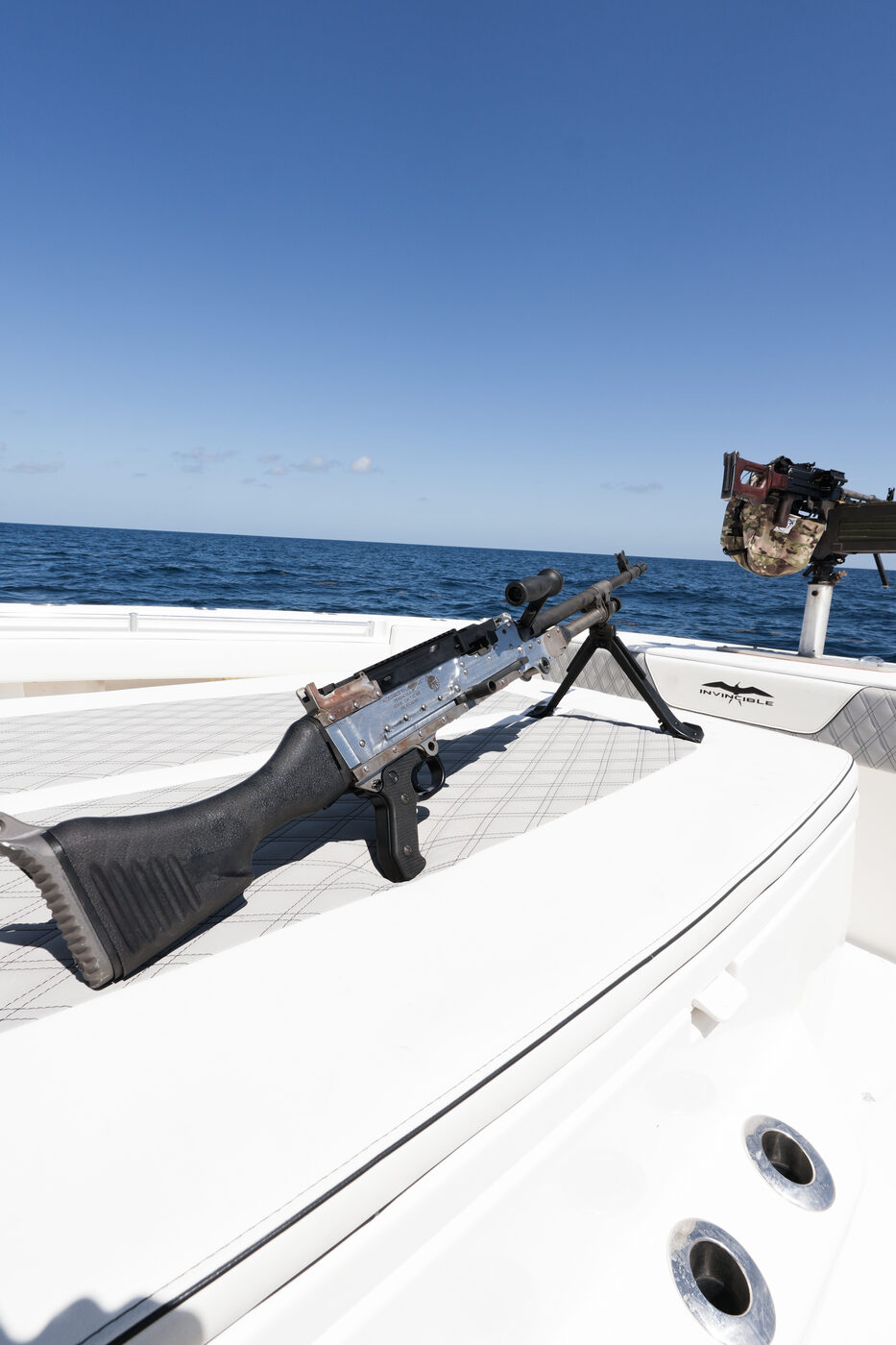 Machine gun on its deck mount aboard 1776 Charters with the open Gulf behind it